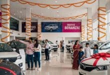 A Car Showroom With Lots Of Cars During Festive Season