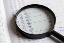 Exam Paper With Magnifying Glass