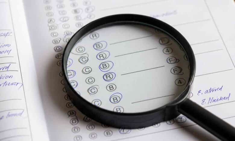 Exam Paper With Magnifying Glass